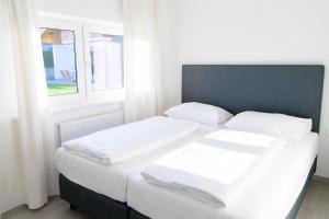 Ein Bett oder Betten in einem Zimmer der Unterkunft Seeappartements Christiane Haus 95
