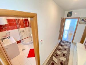 a bathroom with a shower and a toilet and a sink at Guest House Ivano in Mostar +31 photos