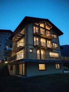 a large building with balconies on the side of it at Chalet MAOL Luxury Living in Valdidentro