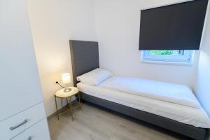 Ein Bett oder Betten in einem Zimmer der Unterkunft Seeappartements Christiane Haus 95