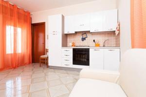 Kuchyň nebo kuchyňský kout v ubytování Il Terrazzo Di Oleandri + 36 fotografií