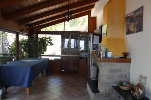 a living room with a table and a fireplace at Villa Incanto B&B in Caprioli +134 photos