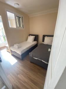 Postel nebo postele na pokoji v ubytování RENT APPART - La Garenne Colombes