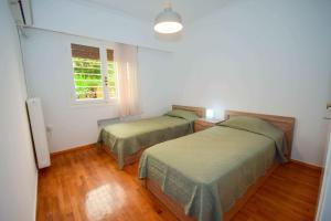 Posteľ alebo postele v izbe v ubytovaní Filoxenia Apartment Athens