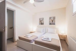 Posteľ alebo postele v izbe v ubytovaní ONAR PORTO RAFTI
