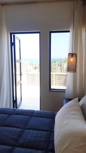 Postel nebo postele na pokoji v ubytování Moyas House