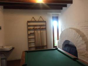 a room with a pool table in front of a wall at Quito Downtown View Point Studio in Quito