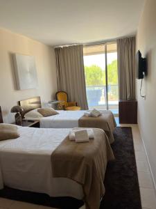 Ένα ή περισσότερα κρεβάτια σε δωμάτιο στο Salgados, Vila das Lagoas +24 φωτογραφίες