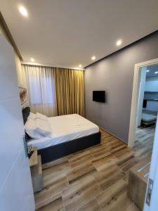 Postel nebo postele na pokoji v ubytování DelMar Apartments