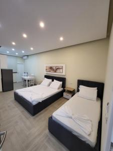 Postel nebo postele na pokoji v ubytování DelMar Apartments