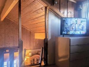 a tv on top of a refrigerator in a room at Holiday home SÄLEN XXIX in Sälen