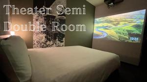 a bedroom with a bed and a painting on the wall at Henn na Hotel Tokyo Haneda in Tokyo