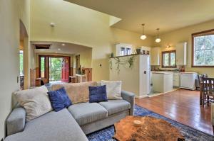 a living room with a couch and a table at Charming Apartment in Downtown Blue Lake! in Blue Lake