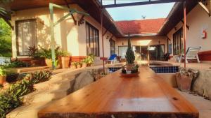 a wooden table on the patio of a house at Samui Diving Resort in Bophut