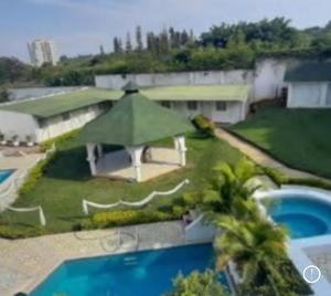 an aerial view of a house with a swimming pool at Hostal Mallorca Boutique in Cali