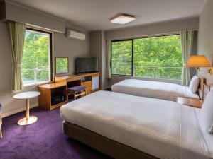 Vuode tai vuoteita majoituspaikassa KAMENOI HOTEL Nikko Yunishigawa All-Inclusive Resort