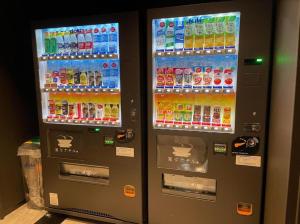 a vending machine filled with lots of drinks at Henn na Hotel Nara in Nara