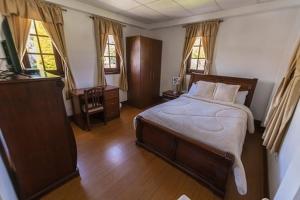 Postel nebo postele na pokoji v ubytování Quinta Spa El Rosal
