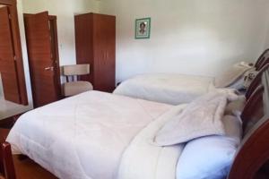 Postel nebo postele na pokoji v ubytování Quinta Spa El Rosal