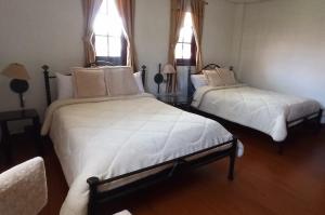 Postel nebo postele na pokoji v ubytování Quinta Spa El Rosal