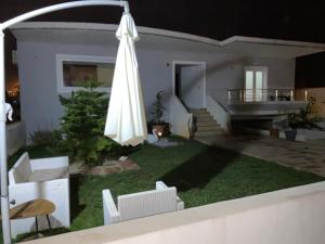 A garden outside Maria's modern studio 5min from beach