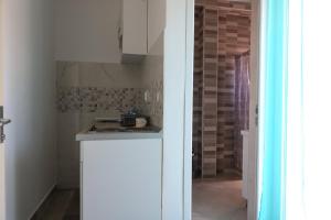 Kuchyň nebo kuchyňský kout v ubytování Apartmani Afterglow
