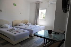 Postel nebo postele na pokoji v ubytování Apartmani Afterglow