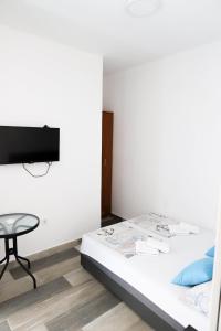 Postel nebo postele na pokoji v ubytování Apartmani Afterglow
