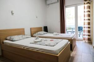 Postel nebo postele na pokoji v ubytování Apartmani Afterglow