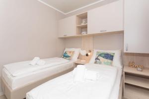 Postel nebo postele na pokoji v ubytování Mara's Coast - Giulia