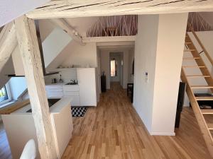 a kitchen and living room in a loft at Apartment Malina - free private parking in Ljubljana