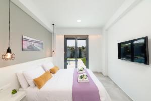 Postel nebo postele na pokoji v ubytování Villa Zaneti by PosarelliVillas