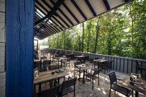 a row of tables and chairs on a patio at Rübli in Freiberg am Neckar