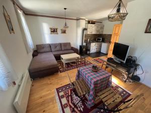 Predel za sedenje v nastanitvi Dormire Apartmans