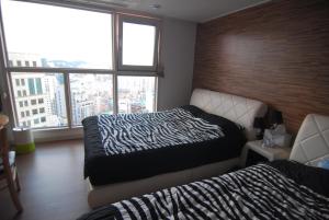 Letto o letti in una camera di Dynamic Guesthouse