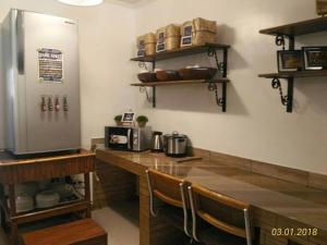 A cozinha ou kitchenette de A Filipino Rustic Style Duplex in Rosario, Cavite UNIT A