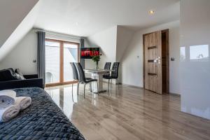 Posedenie v ubytovaní Gąsienica Apartamenty Queen
