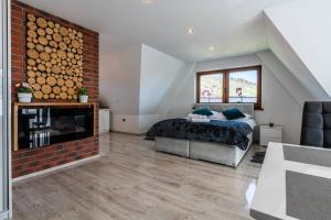 Posteľ alebo postele v izbe v ubytovaní Gąsienica Apartamenty Queen