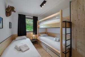 Postel nebo postele na pokoji v ubytování Quintessence - Apt B303 - Châtel - Châtel Multipass Été 2025 en option au tarif de 3euros par jour et par personne