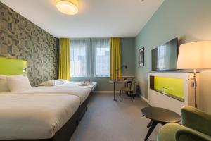 Katil atau katil-katil dalam bilik di Thon Hotel EU