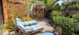 a group of chairs sitting in a garden at La Jovine Sur les hauteurs de cassis T2 Classé in Cassis +11 photos