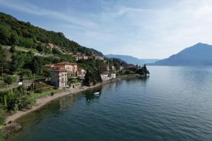 a town on the shore of a body of water at Villa Marina - Como lake in Bellano