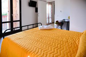 A bed or beds in a room at Mercede Rooms