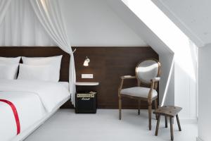 Ένα ή περισσότερα κρεβάτια σε δωμάτιο στο Ruby Rosi Hotel Munich