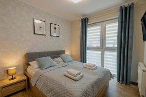 Postel nebo postele na pokoji v ubytování Apartamenty Sun Seasons 24 - Na Wiejskiej