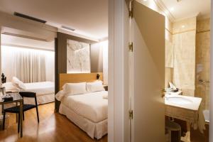 Postel nebo postele na pokoji v ubytování Hotel Dauro Premier