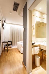 Postel nebo postele na pokoji v ubytování Hotel Dauro Premier