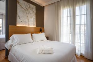 Postel nebo postele na pokoji v ubytování Hotel Dauro Premier