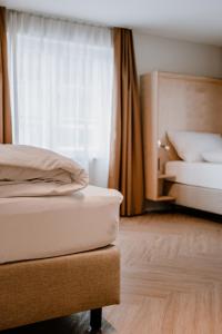 Postel nebo postele na pokoji v ubytování Hotel Müllers Self-Check-In