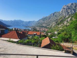 a view of a town with mountains in the background at Apartment Marta in Kotor